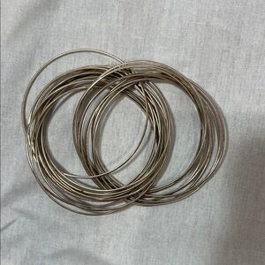 Stack of Thin Metallic Bangle Bracelets - Silver Tone